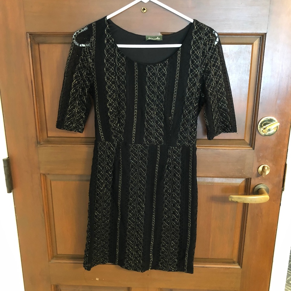 Black mini dress with gold stitching